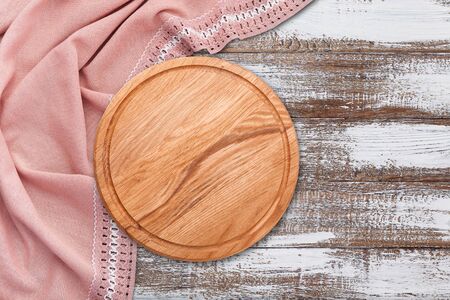 Table cloth and pizza board on vintage wooden table. Top view mock upの写真素材