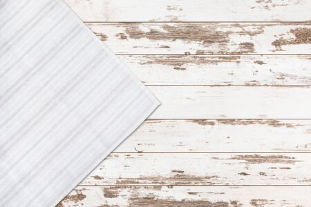 Old vintage wooden table with white tablecloth. Top view mockup.の写真素材