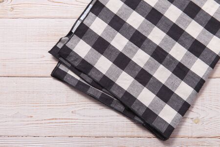 Napkin. Kitchen towel or table cloth on white wooden scene. Mock up for design. Top view mockup.の写真素材