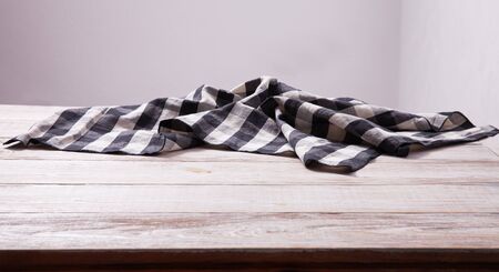 Napkin on white wooden table. Mock up for design. Top view.の写真素材