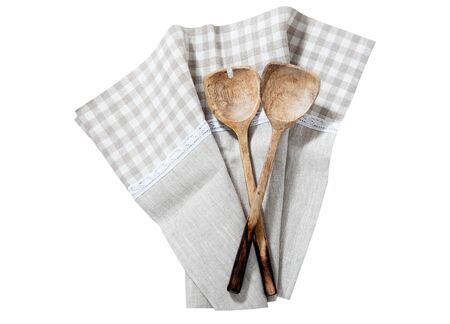 Checkered kitchen towel and kitchen tools isolated on white background. Selective focus. Place for text.の写真素材