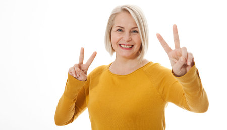 happy excited woman showing the sign of victory