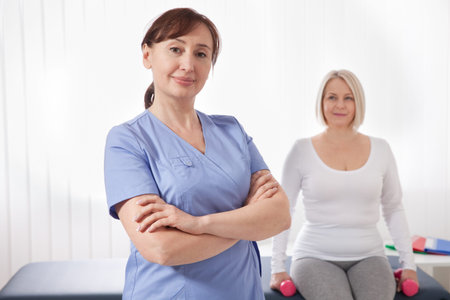 Doctor and patient in rehabilitation clinic. Closeup