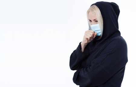 Concept coronavirus, covid-19 respiratory virus. Woman wearing face mask.の写真素材