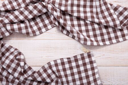 Tablecloth napkin on wood texture. Rustic background. top view.の写真素材