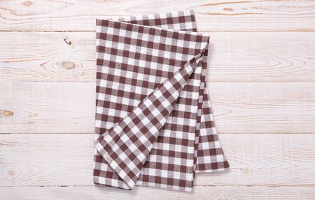 Tablecloth napkin on wood texture. Rustic background. top view.の写真素材