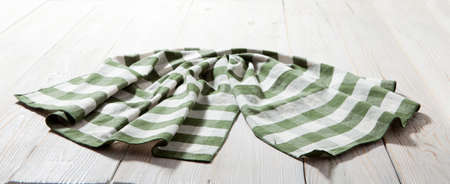 Kitchen towel napkin on wooden background. Top view. Maximum sharpness.の写真素材