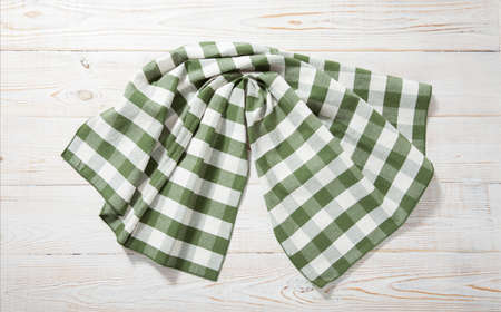 Kitchen towel napkin on wooden background. Top view. Maximum sharpness.の写真素材