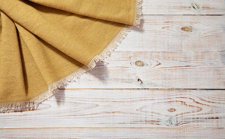 burlap napkin, hessian sacking on wooden backgroundの写真素材