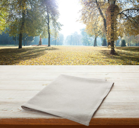 Napkin. Tablecloth tartan, checkered, dish towels on wooden table perspective. Autumn background.