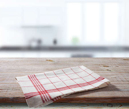 White napkin, table cloth on wooden deck mockup. Kitchen interior backgroundの写真素材
