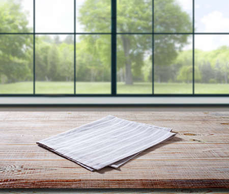 White napkin, table cloth on wooden deck mockup. Kitchen interior backgroundの写真素材