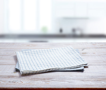 Kitchen towel, napkin on wooden desk. Top view mockup