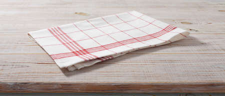 napkin, tablecloth on wooden deck front view mockupの写真素材