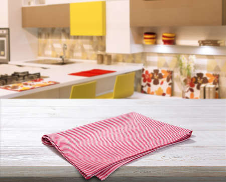 Red napkin on white wooden table top viewの写真素材