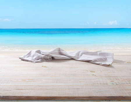 White napkin, table cloth on wooden deck mockup.の写真素材