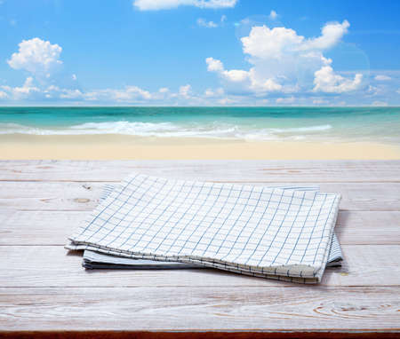 Kitchen towel, napkin on wooden desk. Top view mockupの写真素材