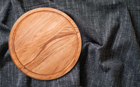 Pizza board with a napkin isolated. top view mock upの写真素材