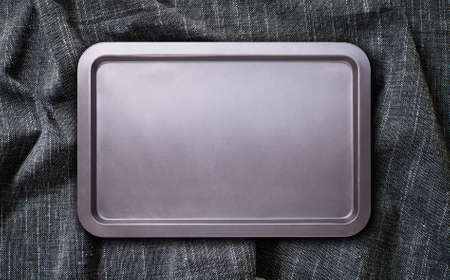Baking tray with tablecloth, napkin. Top view mockupの写真素材