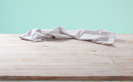 White napkin, table cloth on wooden deck mockup.の写真素材