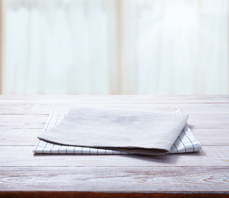 Napkin, table cloth on wooden deck mockup.