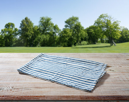 Napkin on wooden table perspective. spring background.の写真素材