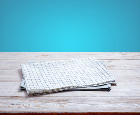 Kitchen towel, napkin on wooden desk. Top view mockupの写真素材