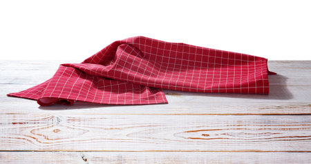 Red table cloth on wooden desk isolated on white.の写真素材