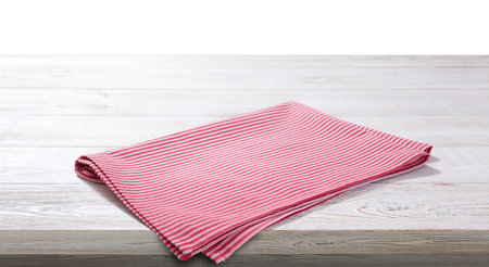 Red napkin on white wooden table top viewの写真素材