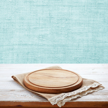 Take your pizza promotion to the next level with our round cutting board on napkin, mockup. nice pastel backgroundの写真素材