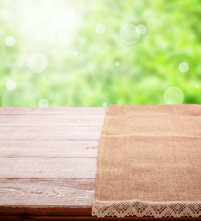 The perfect combination of rustic chic style - our linen burlap napkin with lace on wooden desk closeup. bright nature backgroundの写真素材