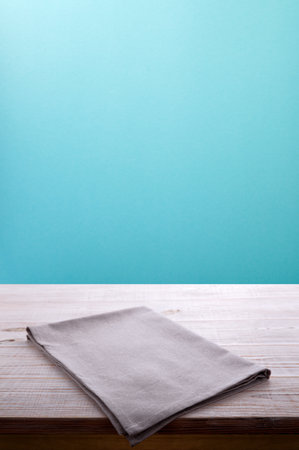 Surprise your web site visitors with this elegant rustic chic napkin on wooden table using them as a display case for items. White tablecloth front view mockup perspective.の写真素材
