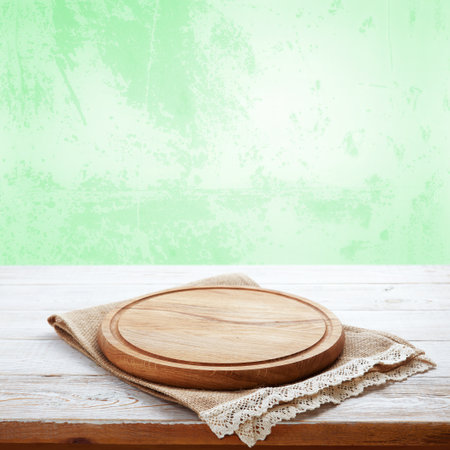 Add a touch of sophistication to your with this wooden pizza board and napkin. Nice green pastel backgroundの写真素材