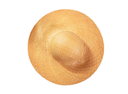 Pretty straw hat with ribbon and bow on white background. Beach hat top view isolatedの写真素材