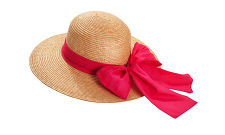 Pretty straw hat with ribbon and bow on white background. Beach hat top view isolatedの写真素材