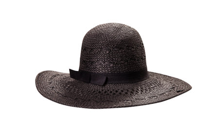 Beautiful black straw hat with ribbon and bow on white background. Beach hat top view isolatedの写真素材