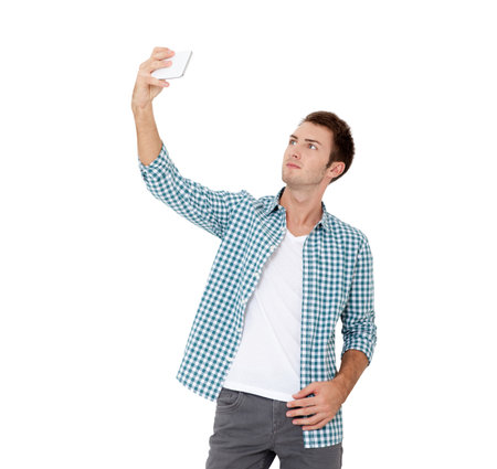 Young urban professional man using smart phone. Businessman holding mobile smartphone using app video message isolated on white backgroundの写真素材