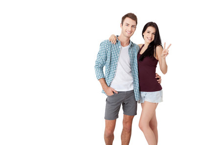 Young couple in love over isolated background very happy and excited hug each other, smiling and screaming for success. Celebration concept.の写真素材