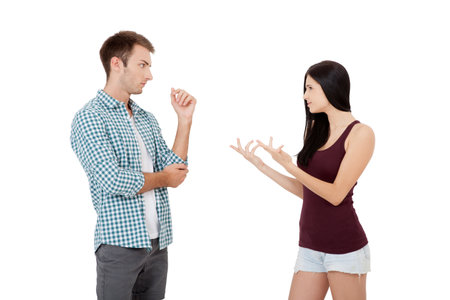 Couple talking arguing on each other isolated on white backgroundの写真素材