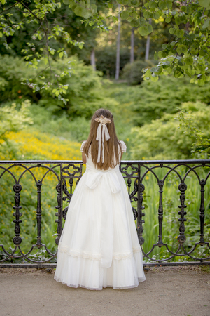 Girls of communion in a park in Madrid, Spainの写真素材