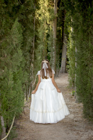Girls of communion in a park in Madrid, Spainの写真素材
