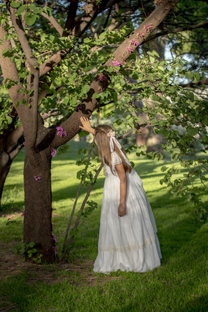 Girls of communion in a park in Madrid, Spainの写真素材