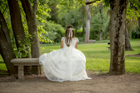 Girls of communion in a park in Madrid, Spainの写真素材