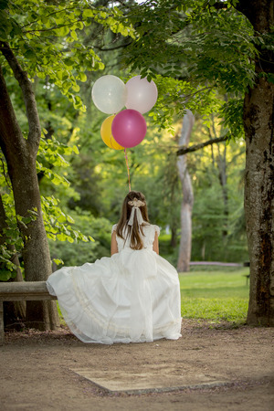 Girls of communion in a park in Madrid, Spainの写真素材