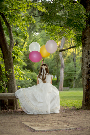 Girls of communion in a park in Madrid, Spainの写真素材