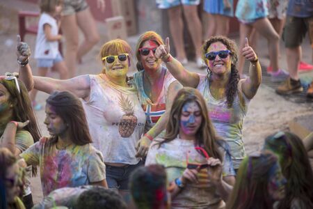 Holi run, in Galapagos, Guadalajara, Spain, on August 26, 2018, men women and children have fun in a popular race.のeditorial素材