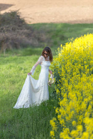 bride in the fieldの写真素材