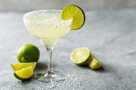 Classic Margarita Cocktail with Lime and Salt on a Gray Backgroundの素材