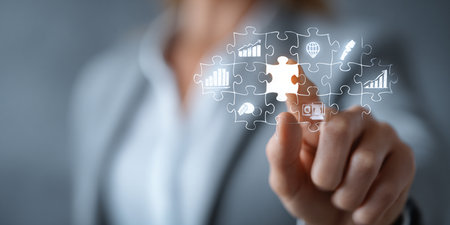 Businesswoman connecting jigsaw puzzle pieces. Business strategy and solution conceptの素材