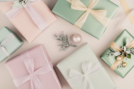 top view of christmas gifts with ribbons on beige backgroundの素材